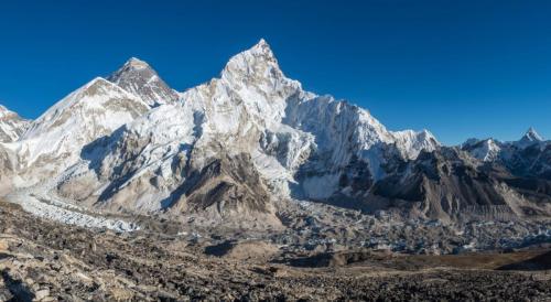 landscape-shot-beautiful-valley-surrounded-by-huge-mountains-with-snowy-peaks
